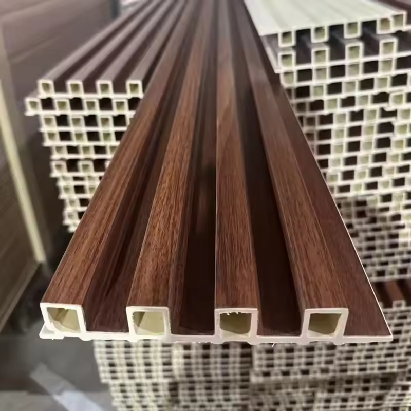 Fire-resistant grooved decorative wood-plastic composite PVC wall panels for interior wall decoration.