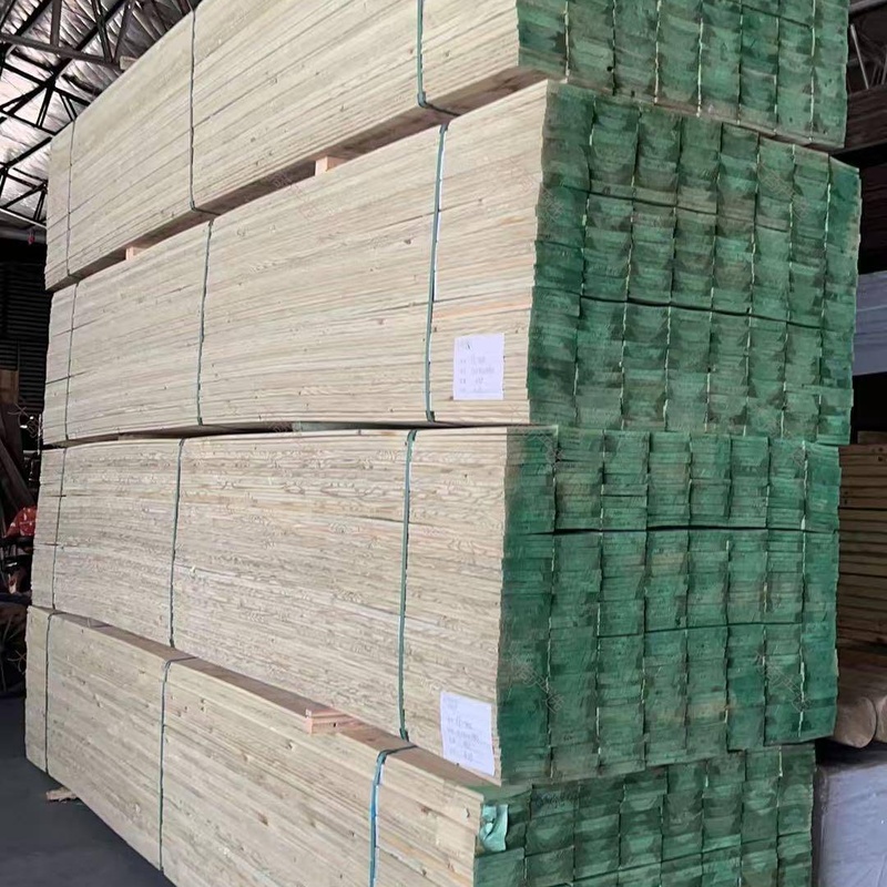 ACQ Pressure-Treated Pine Lumber Green Preservative Outdoor Decking Boards Stacked Pallets	